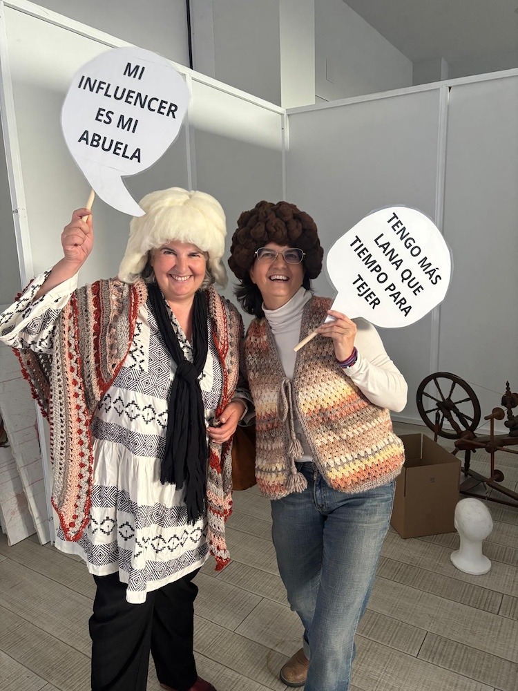 A volunteer with Concha Rey celebrating wool